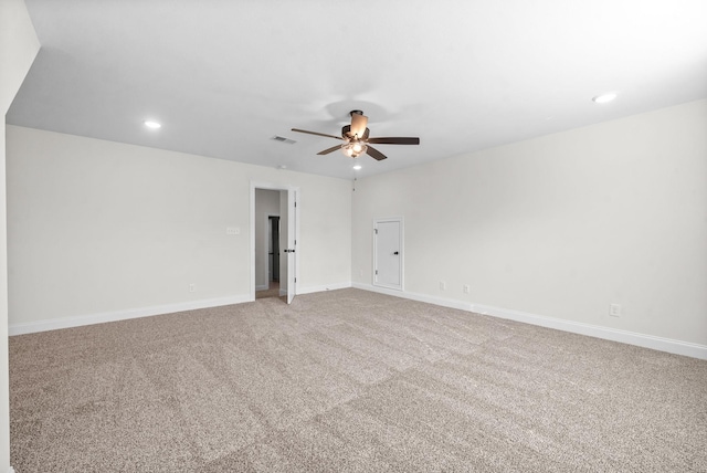 unfurnished room with ceiling fan and carpet floors