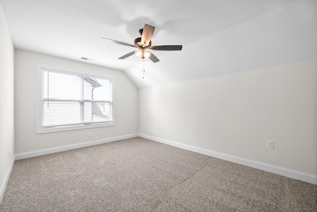 additional living space featuring ceiling fan, carpet floors, and lofted ceiling