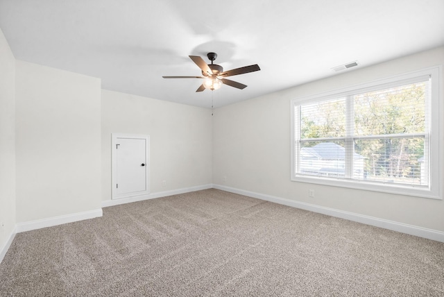 spare room with carpet flooring and ceiling fan