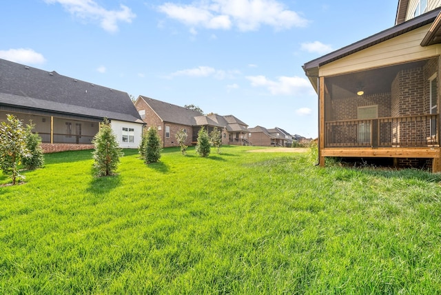 view of yard featuring a wooden deck