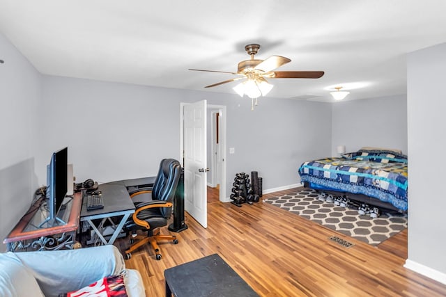 bedroom with hardwood / wood-style flooring and ceiling fan