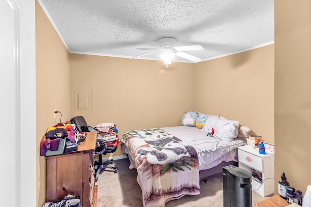 bedroom with light carpet, a textured ceiling, ceiling fan, and ornamental molding