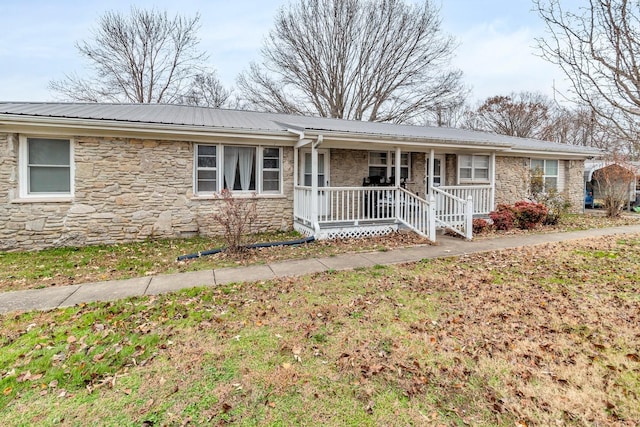 ranch-style house with covered porch