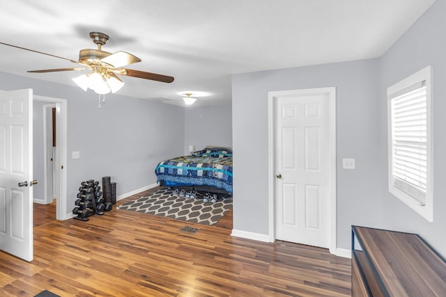 bedroom with hardwood / wood-style flooring and ceiling fan