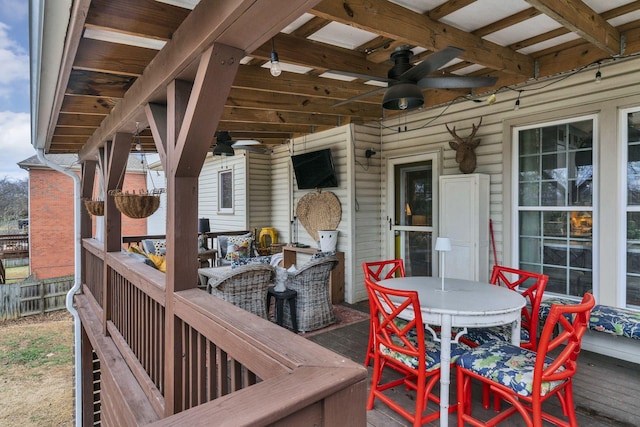 wooden terrace featuring ceiling fan