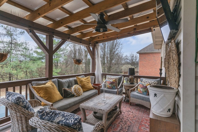 wooden deck featuring an outdoor hangout area and ceiling fan