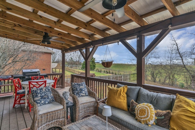 deck featuring ceiling fan and an outdoor hangout area