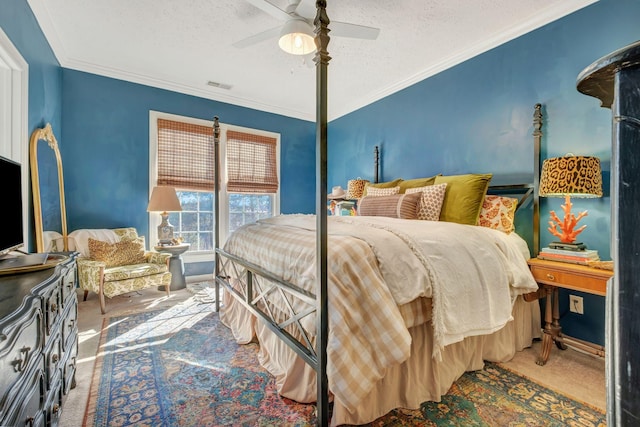 bedroom featuring crown molding, ceiling fan, carpet flooring, and a textured ceiling