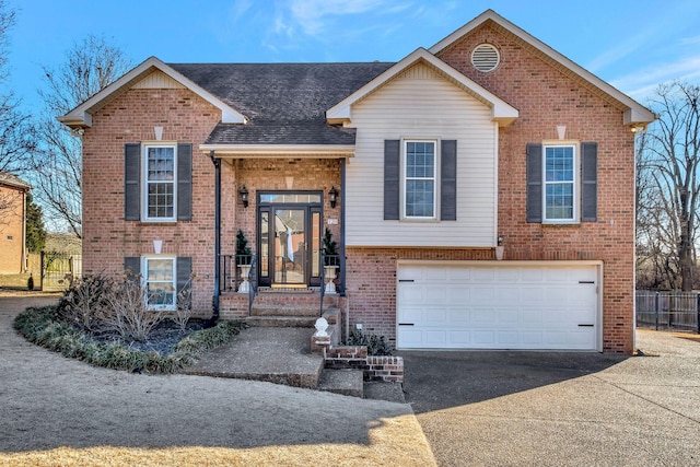 raised ranch featuring a garage