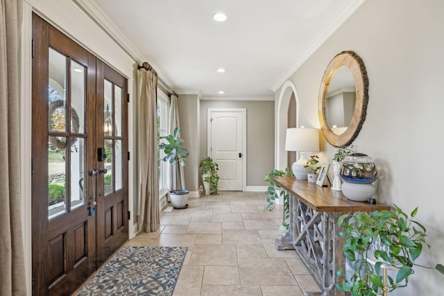 entrance foyer with french doors and crown molding