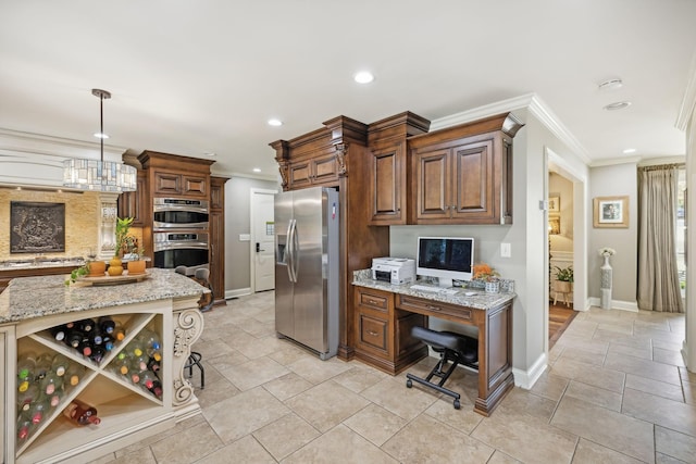 kitchen featuring crown molding, a breakfast bar area, light stone countertops, decorative light fixtures, and stainless steel appliances