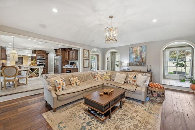 living room featuring dark hardwood / wood-style floors and a chandelier