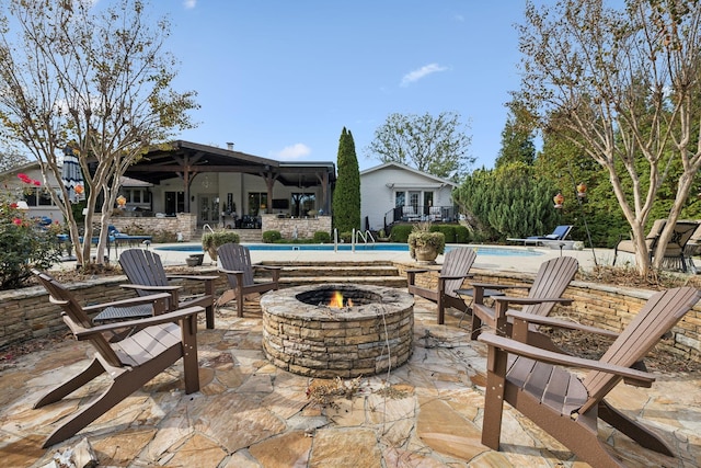 view of patio / terrace featuring a fire pit