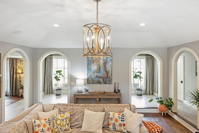 living room featuring a chandelier and hardwood / wood-style flooring