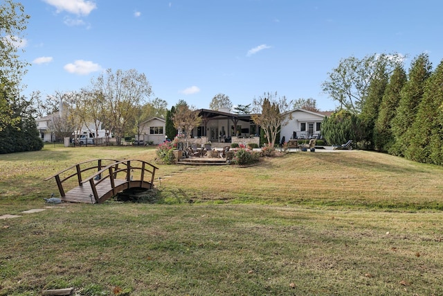 view of home's community with a yard