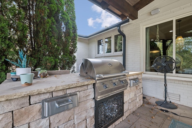 view of patio featuring a grill and exterior kitchen