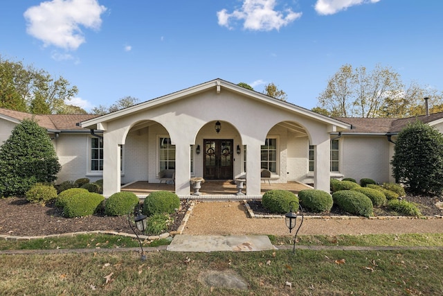 single story home featuring a porch