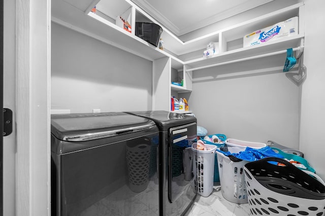 washroom featuring washer and dryer and crown molding