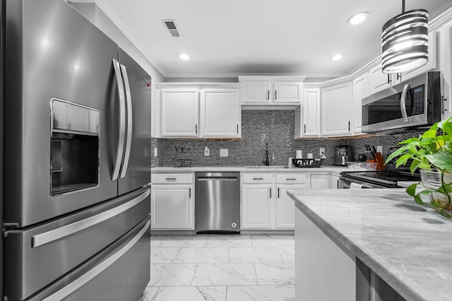 kitchen featuring stainless steel appliances, white cabinetry, tasteful backsplash, and sink