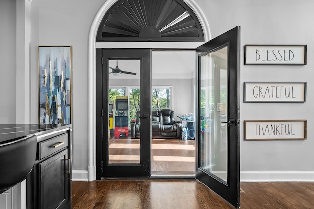 doorway with french doors, dark hardwood / wood-style flooring, and ceiling fan