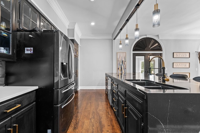 kitchen with sink, crown molding, stainless steel fridge, decorative light fixtures, and dark hardwood / wood-style flooring