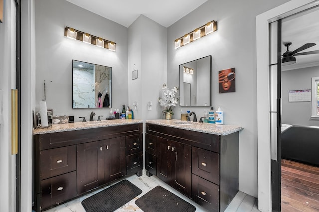 bathroom featuring ceiling fan and vanity