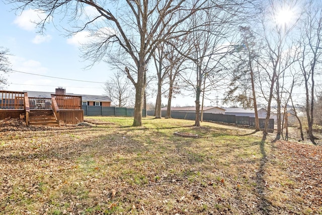 view of yard featuring a wooden deck