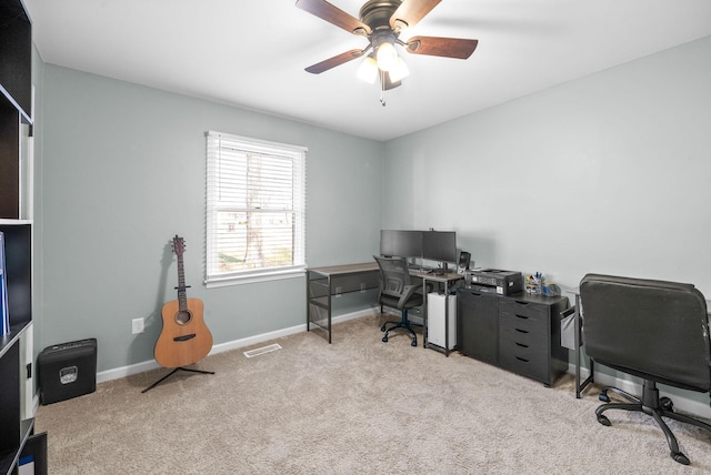 office area with ceiling fan and light carpet