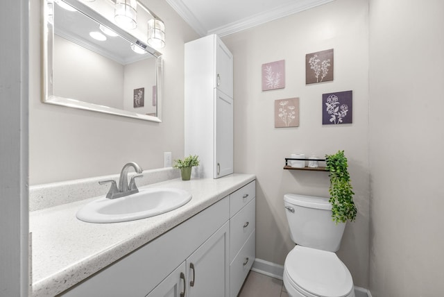 bathroom featuring crown molding, tile patterned flooring, vanity, and toilet