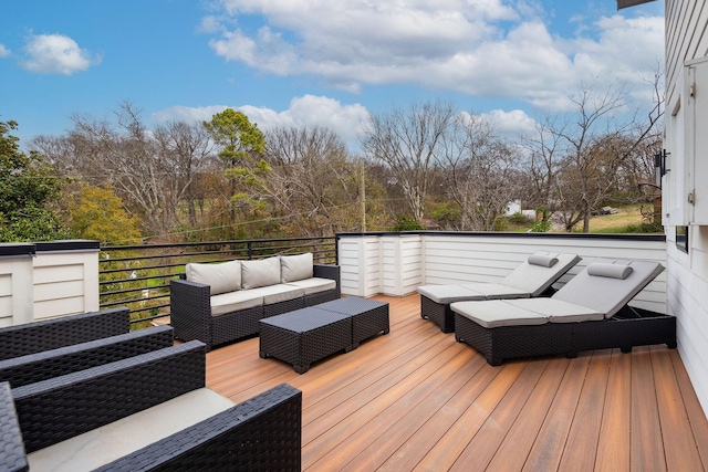 wooden terrace featuring an outdoor living space