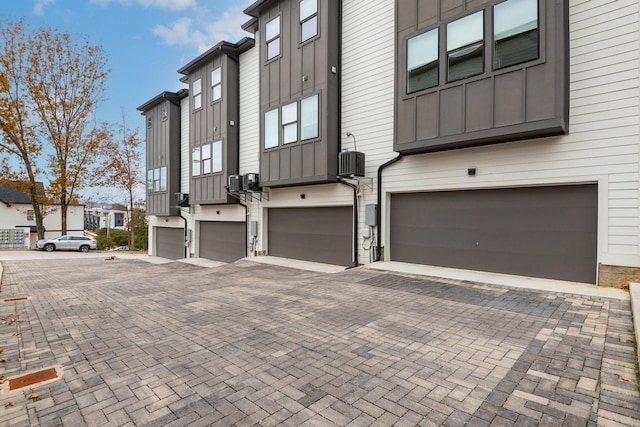 view of side of property with a garage