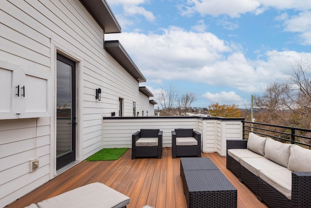 wooden terrace featuring outdoor lounge area