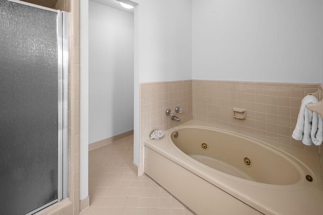 bathroom with tile patterned floors and separate shower and tub