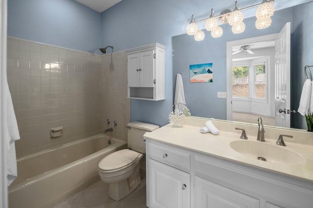 full bathroom with tile patterned floors, vanity, tiled shower / bath combo, ceiling fan, and toilet