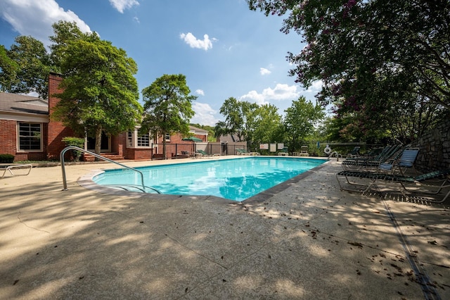 view of swimming pool featuring a patio