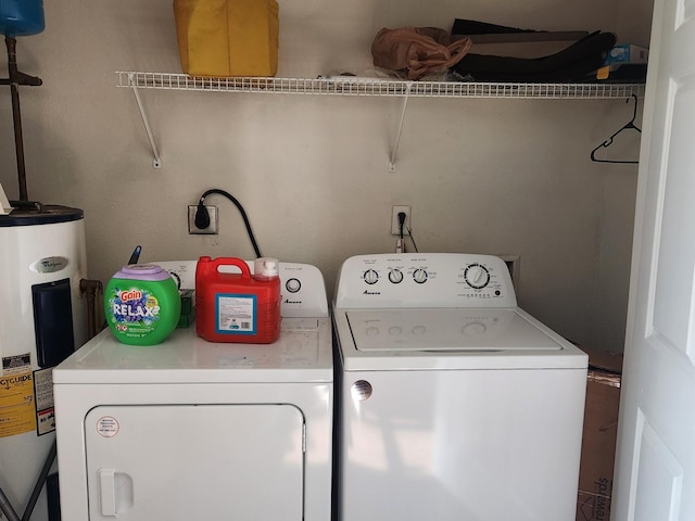 washroom featuring washer and dryer and electric water heater