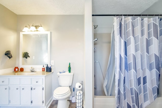 full bathroom with shower / bath combo, vanity, a textured ceiling, and toilet