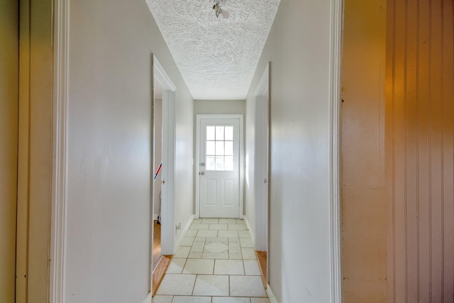 hallway with light tile patterned flooring