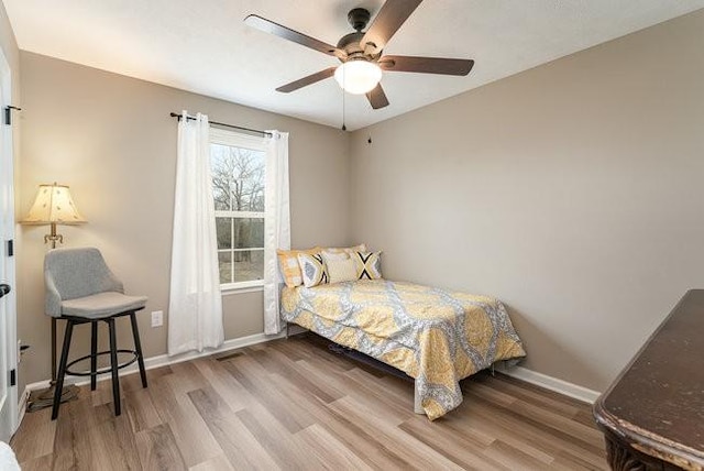 bedroom featuring wood-type flooring and ceiling fan