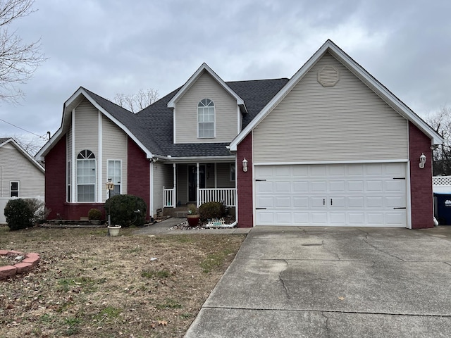 view of front property featuring a porch and a garage