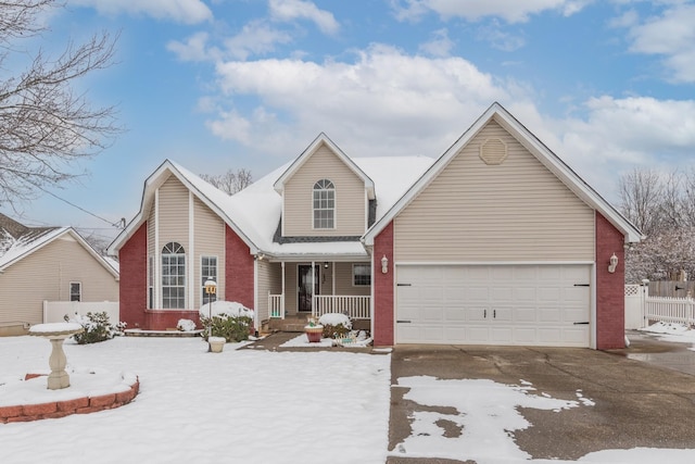 view of front of property featuring a porch and a garage