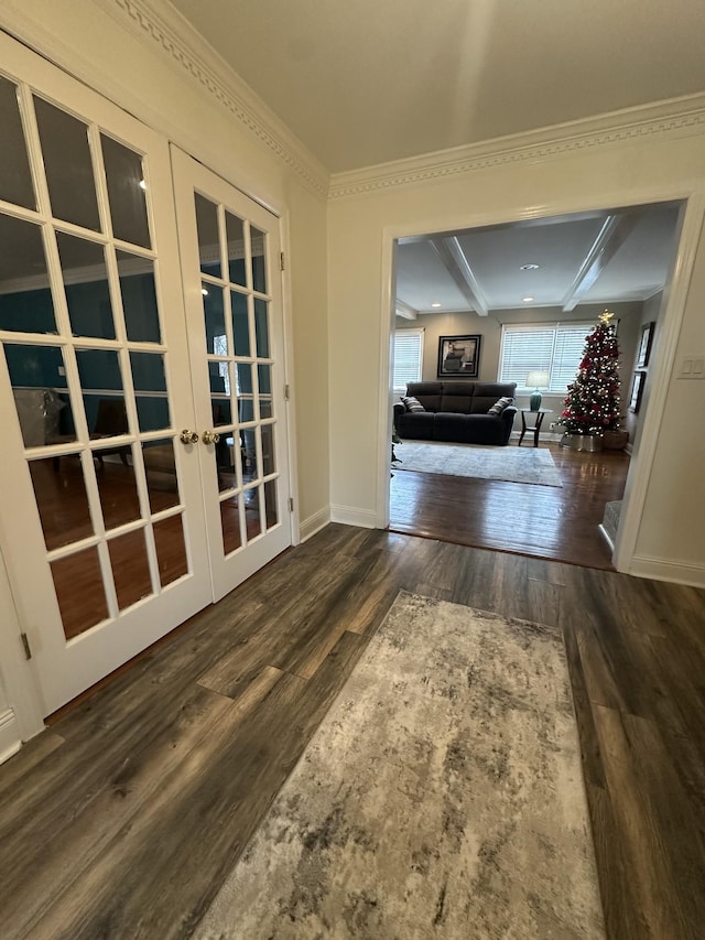 corridor with french doors, dark hardwood / wood-style floors, and ornamental molding