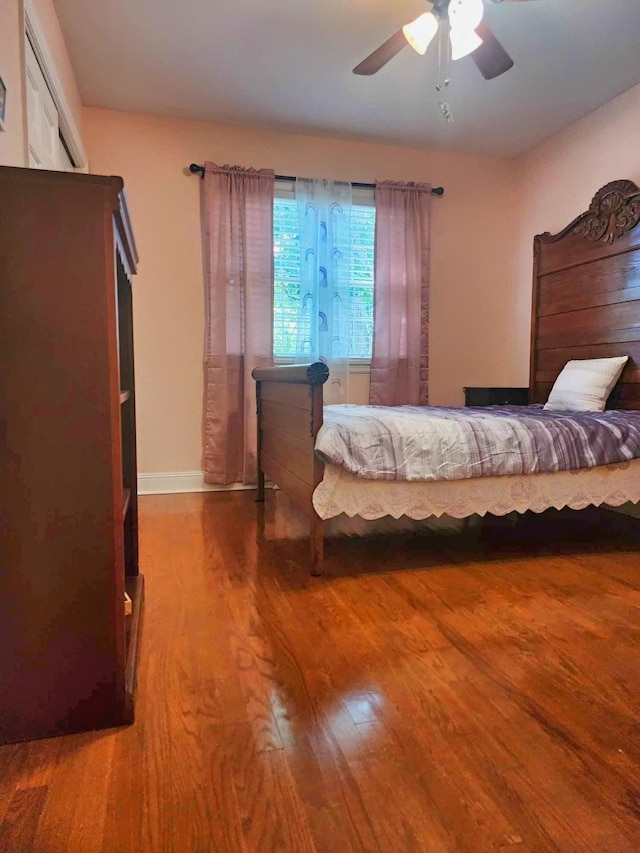 bedroom featuring ceiling fan and wood-type flooring