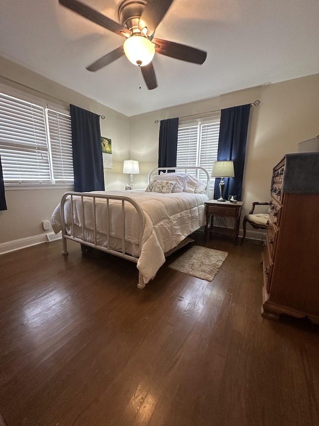 bedroom featuring ceiling fan and dark hardwood / wood-style floors