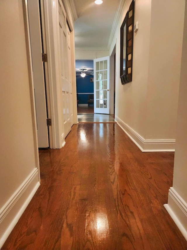 hall with hardwood / wood-style floors and french doors