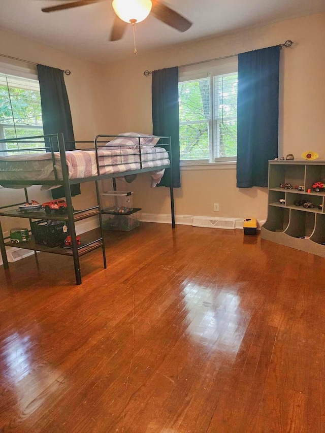 bedroom featuring ceiling fan and hardwood / wood-style floors