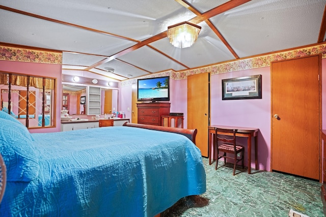 bedroom with a textured ceiling and vaulted ceiling