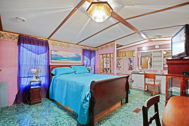 carpeted bedroom with a textured ceiling and lofted ceiling