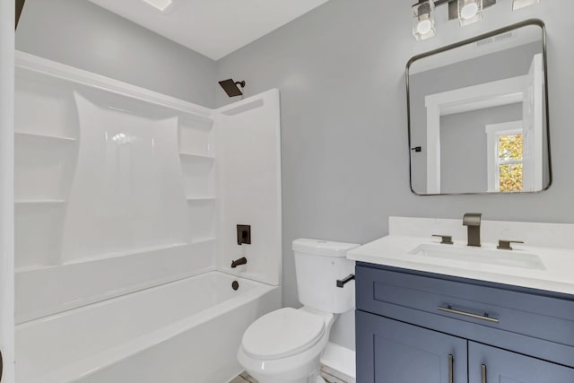 full bathroom featuring vanity, shower / bath combination, and toilet