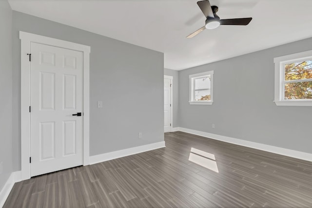 interior space with ceiling fan and wood-type flooring